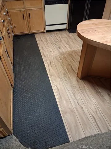 a view of a livingroom with furniture hardwood floor and a ceiling fan