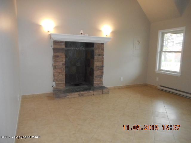 151 Ryan Road Blakeslee, PA 18610 - Photo 4 of 13 an empty room with windows