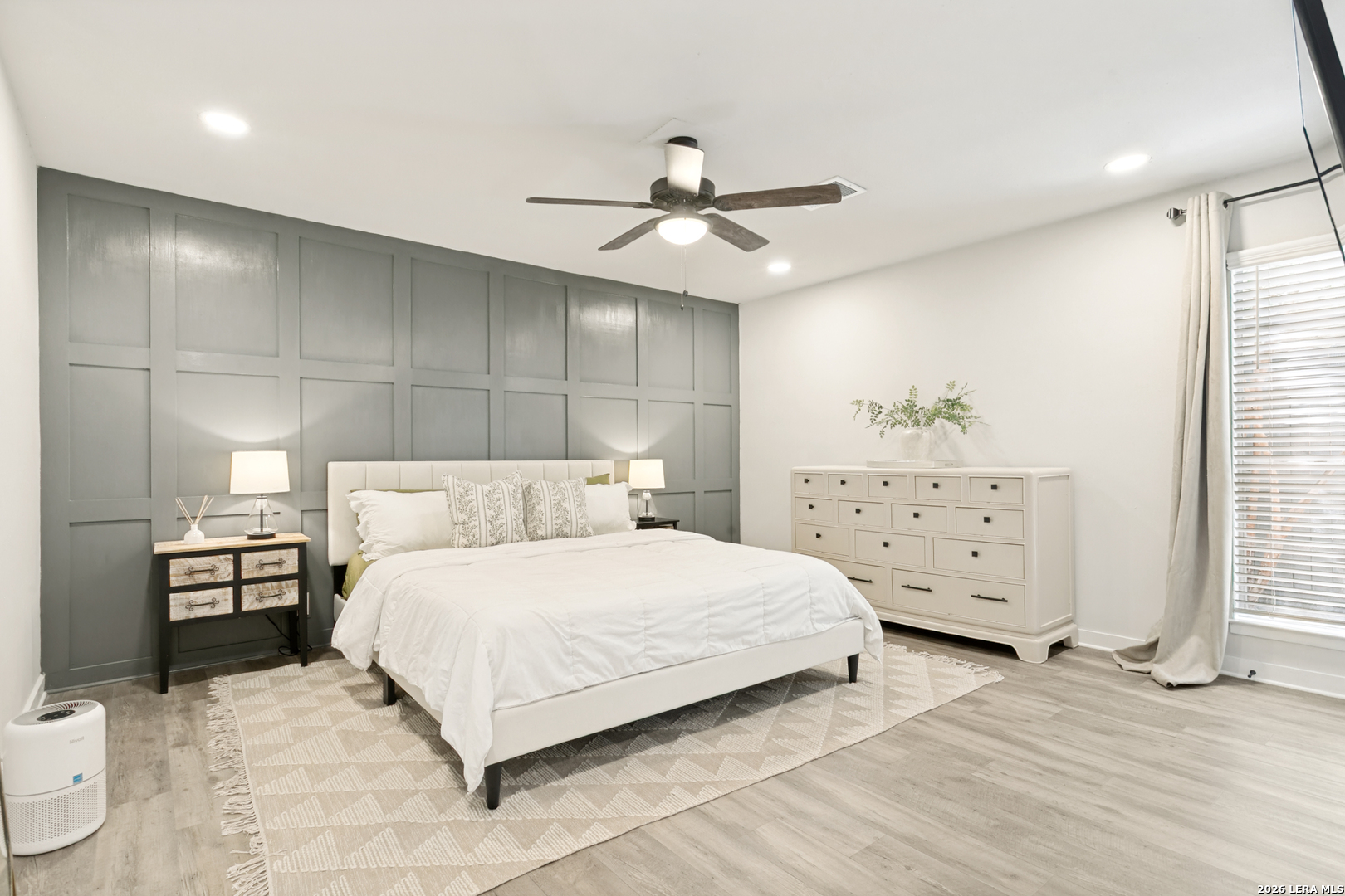102 Silver Spring Universal City, TX 78148 - Photo 20 of 36 a bedroom with a bed and wooden floor