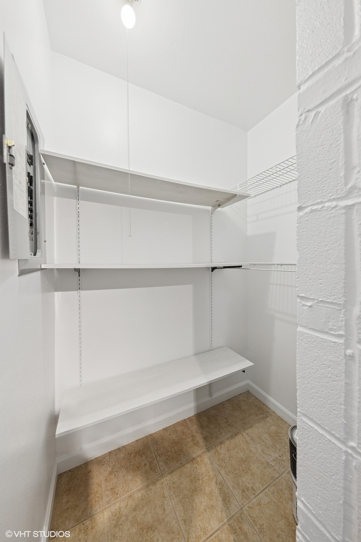 5900 Forest View Road, Unit 2A Lisle, IL 60532 - Photo 9 of 24 a view of a room with racks on the wall