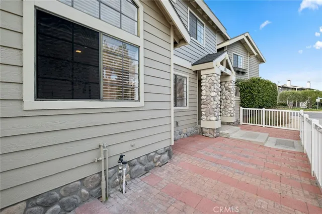 a view of a house with a bench