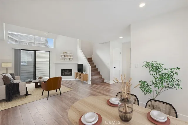 a living room with furniture potted plant and a fireplace