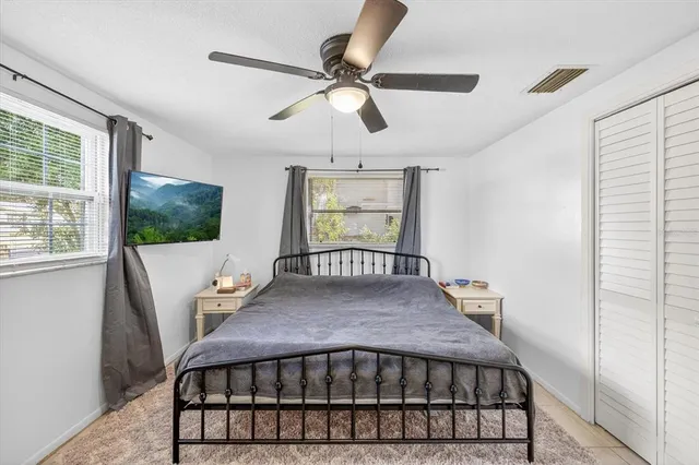 a bed room with furniture and window