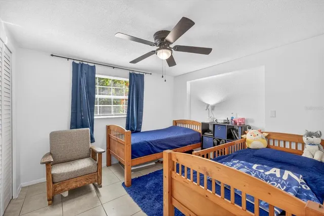 a bedroom with furniture and a window