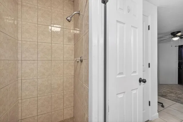 a bathroom with a glass shower door