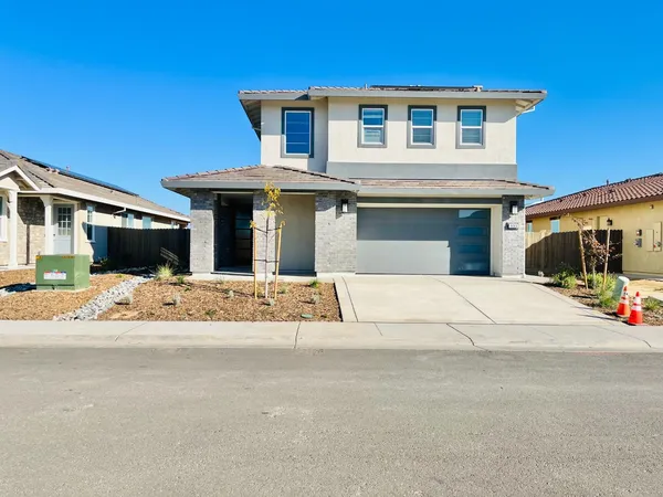a front view of a house with a outdoor space