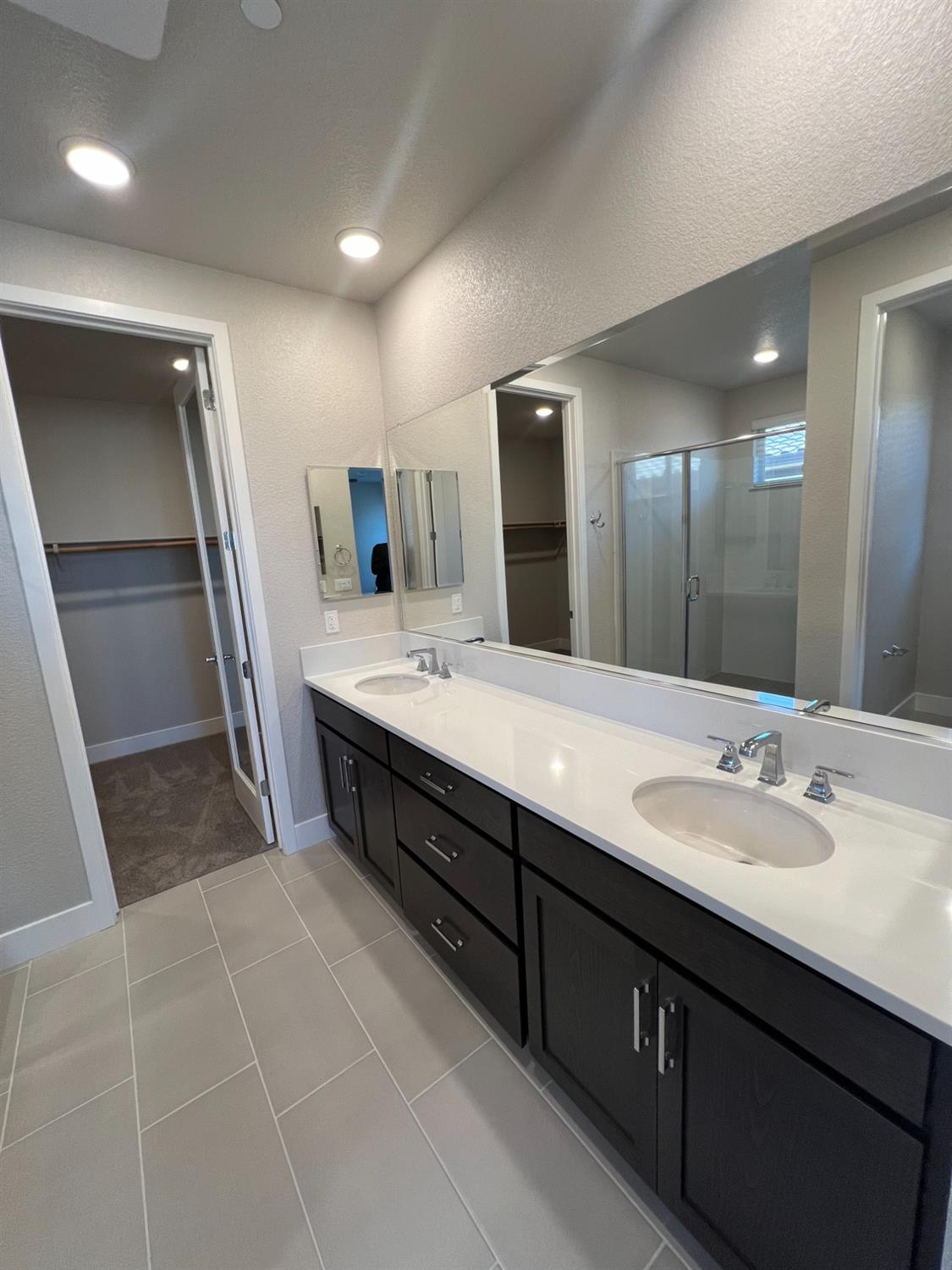 3063 Banano Way Rancho Cordova, CA 95742 - Photo 11 of 20 a bathroom with a double vanity sink a and mirror
