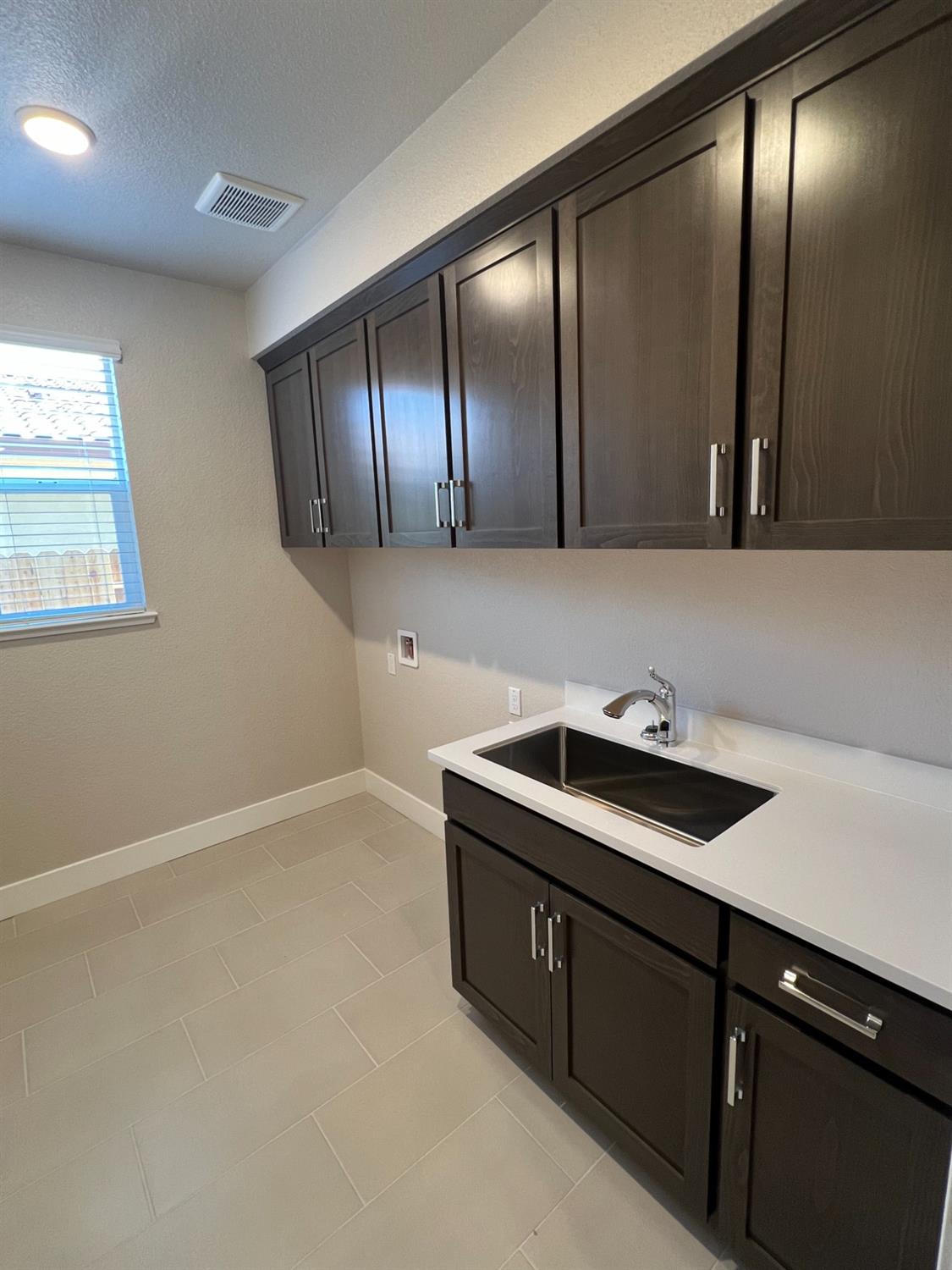 3063 Banano Way Rancho Cordova, CA 95742 - Photo 6 of 20 a bathroom with a sink and a mirror