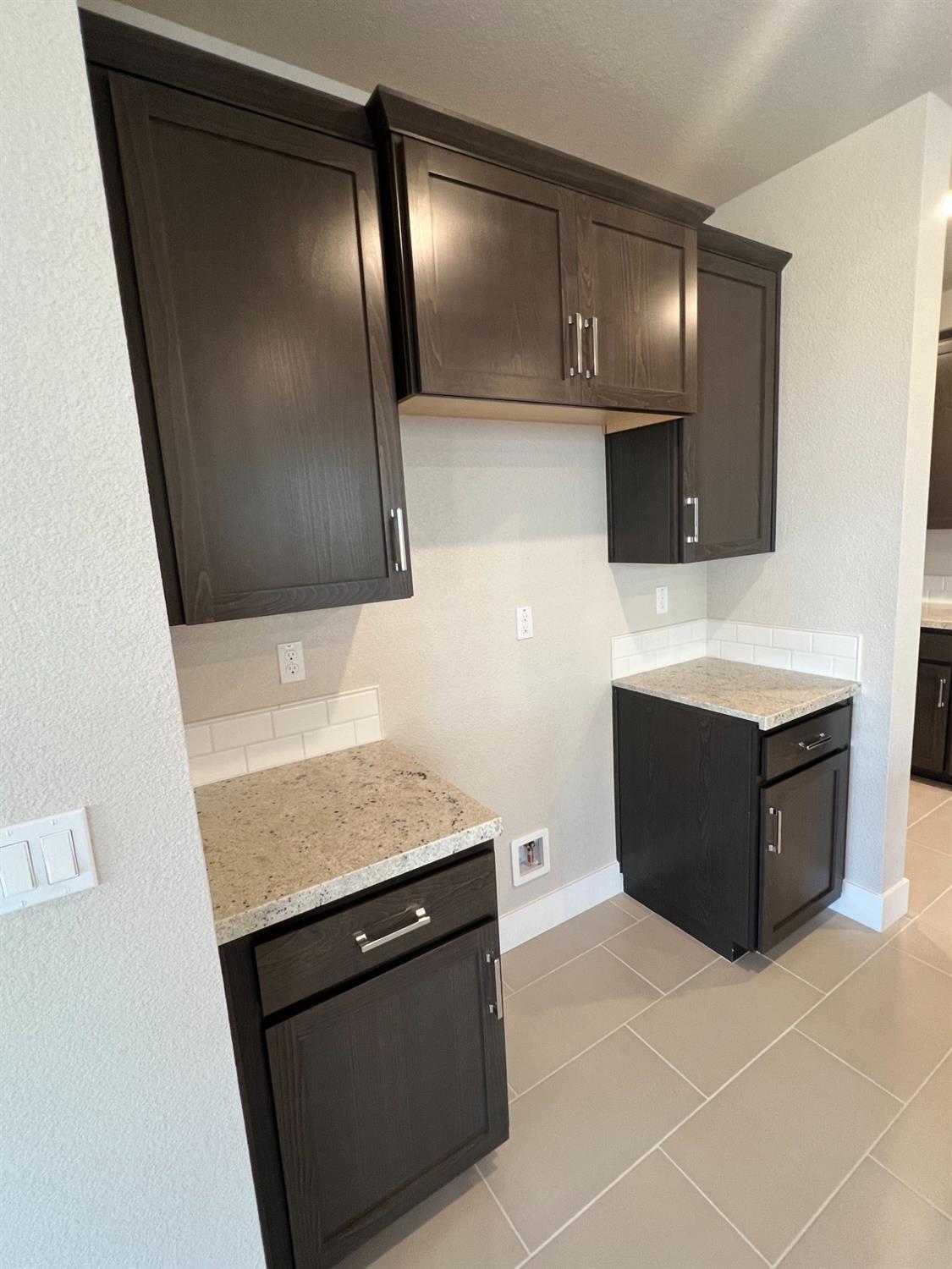 3063 Banano Way Rancho Cordova, CA 95742 - Photo 7 of 20 a kitchen with a sink a stove and cabinets