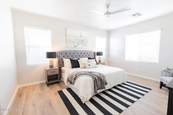 a bedroom with bed and a window