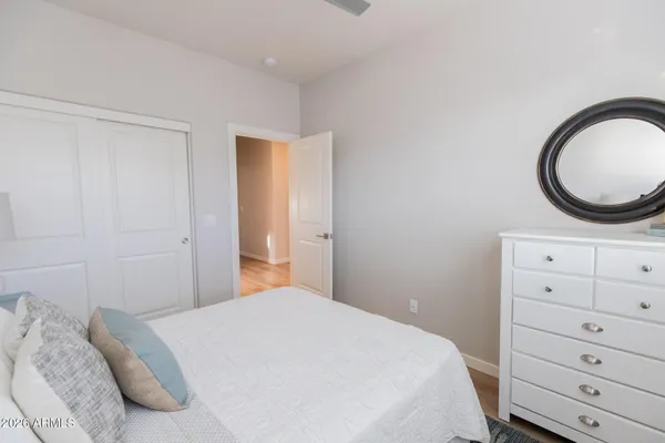 a bedroom with a bed and a dresser