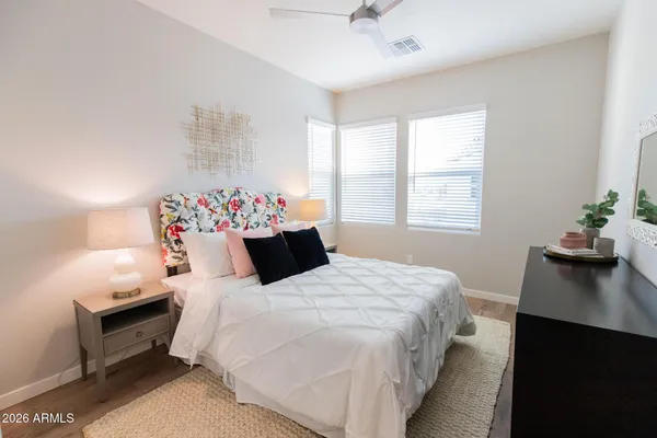 a bedroom with a bed and a desk
