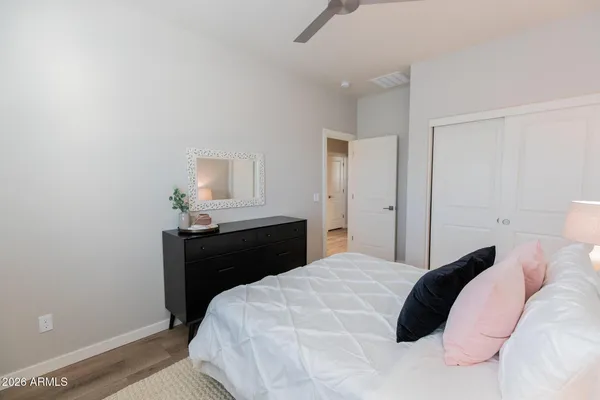 a bedroom with a bed and a table