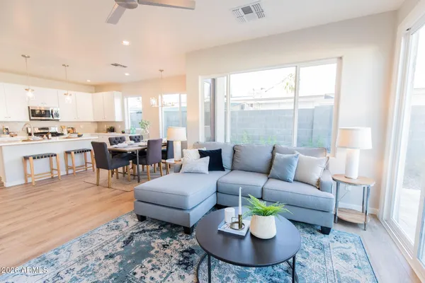 a living room with furniture and a large window