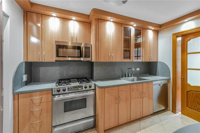 a kitchen with a stove and a microwave