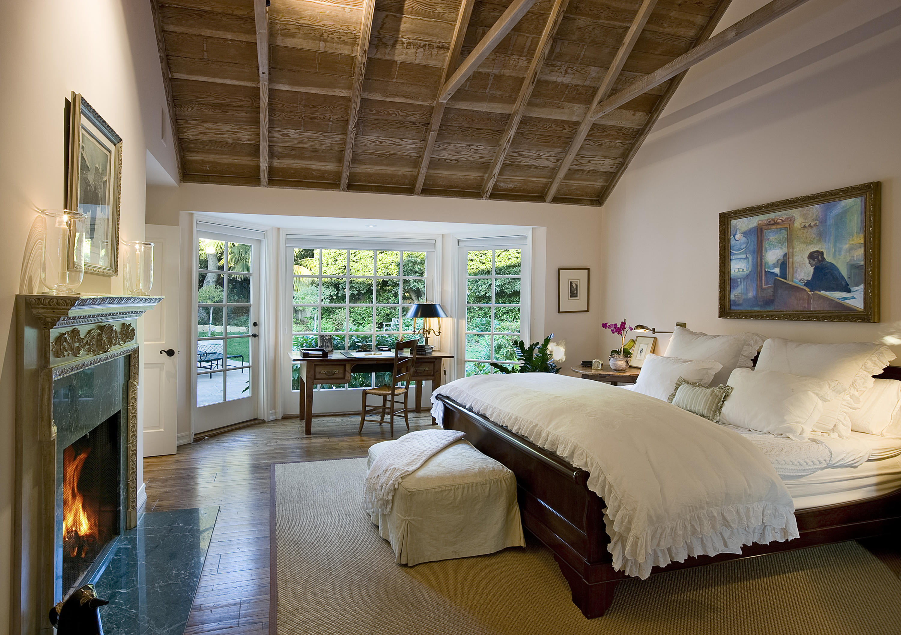 1966 East Valley Road Santa Barbara, CA 93108 - Photo 6 of 16 a spacious bedroom with a balcony a bed and a fireplace