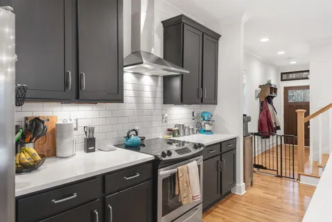 a kitchen with a sink and cabinets