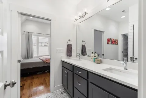 a en suite bathroom with a sink and a mirror