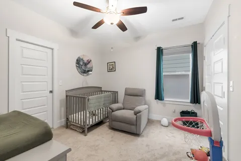 a bedroom with furniture and a window