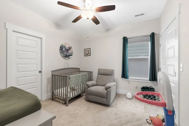 a bedroom with furniture and a window