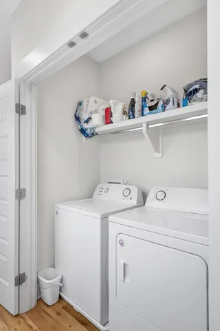 a view of storage and utility room with washer and dryer