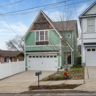 a front view of a house with garage
