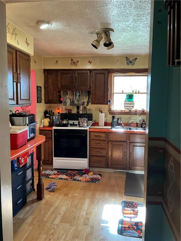 1652 Frew Mill Road New Castle, PA 16101 - Photo 11 of 25 a kitchen with a stove a refrigerator and a stove