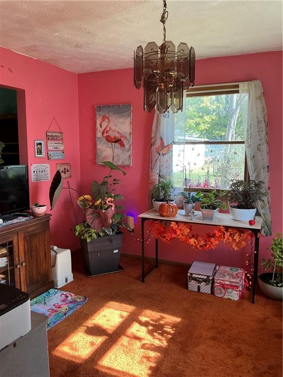 1652 Frew Mill Road New Castle, PA 16101 - Photo 13 of 25 a room with furniture and a chandelier