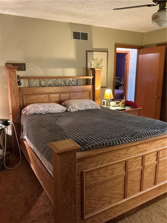 1652 Frew Mill Road New Castle, PA 16101 - Photo 16 of 25 a bed sitting in a bedroom and mirror