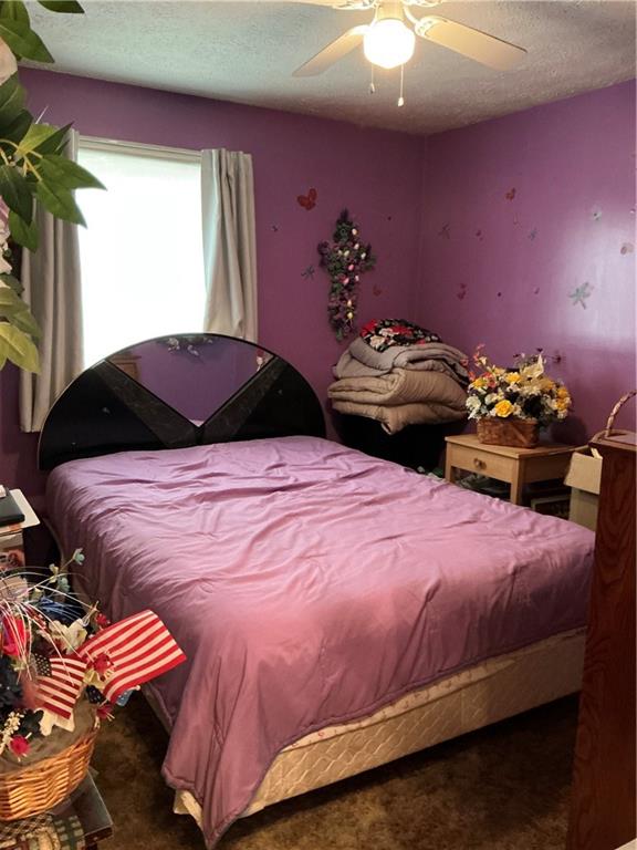 1652 Frew Mill Road New Castle, PA 16101 - Photo 18 of 25 a bedroom with a bed and a chandelier