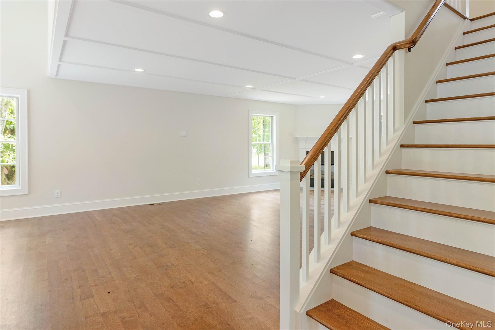 130 Sunset Lane Greenport, NY 11944 - Photo 15 of 34 Stairs with wood finished floors and recessed lighting
