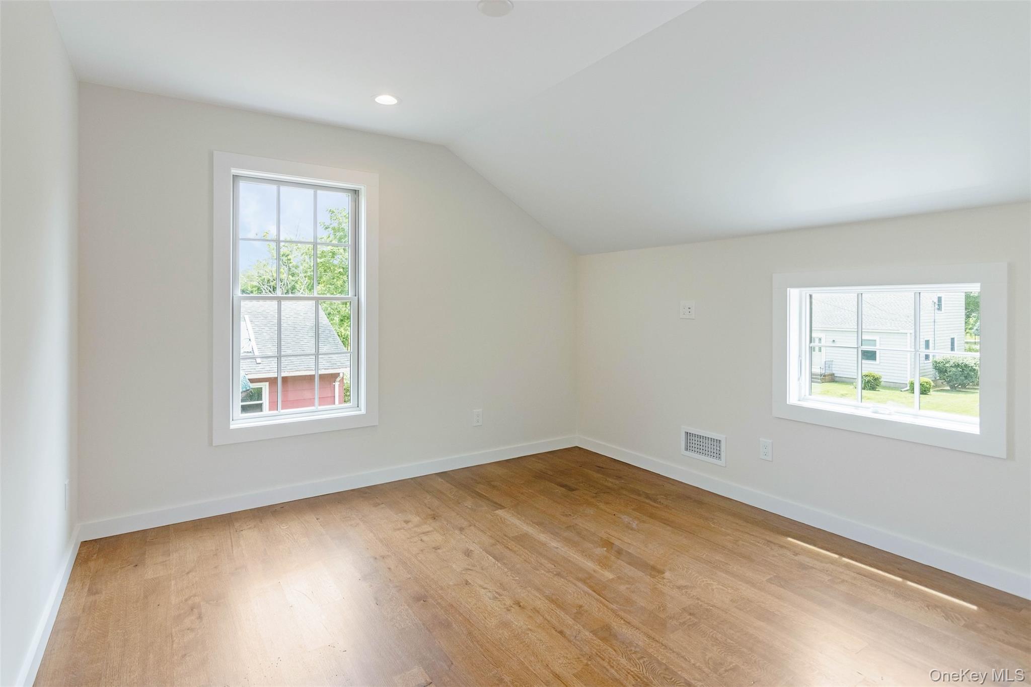 130 Sunset Lane Greenport, NY 11944 - Photo 16 of 34 Additional living space with light wood-style floors and lofted ceiling