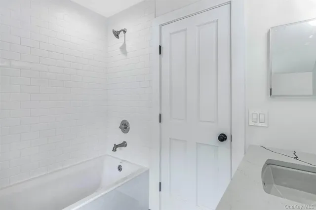 a bathroom with a sink a toilet and a window