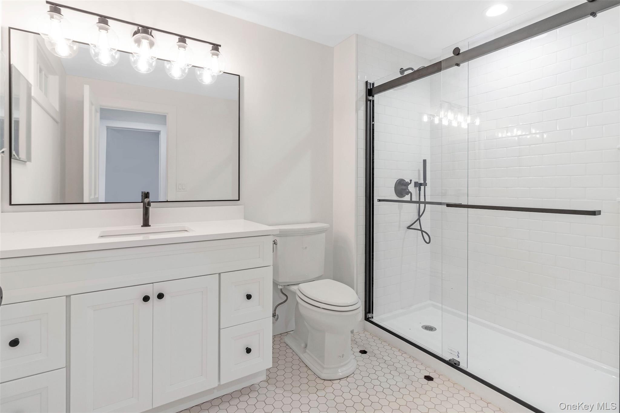 130 Sunset Lane Greenport, NY 11944 - Photo 25 of 34 Bathroom with a stall shower and vanity