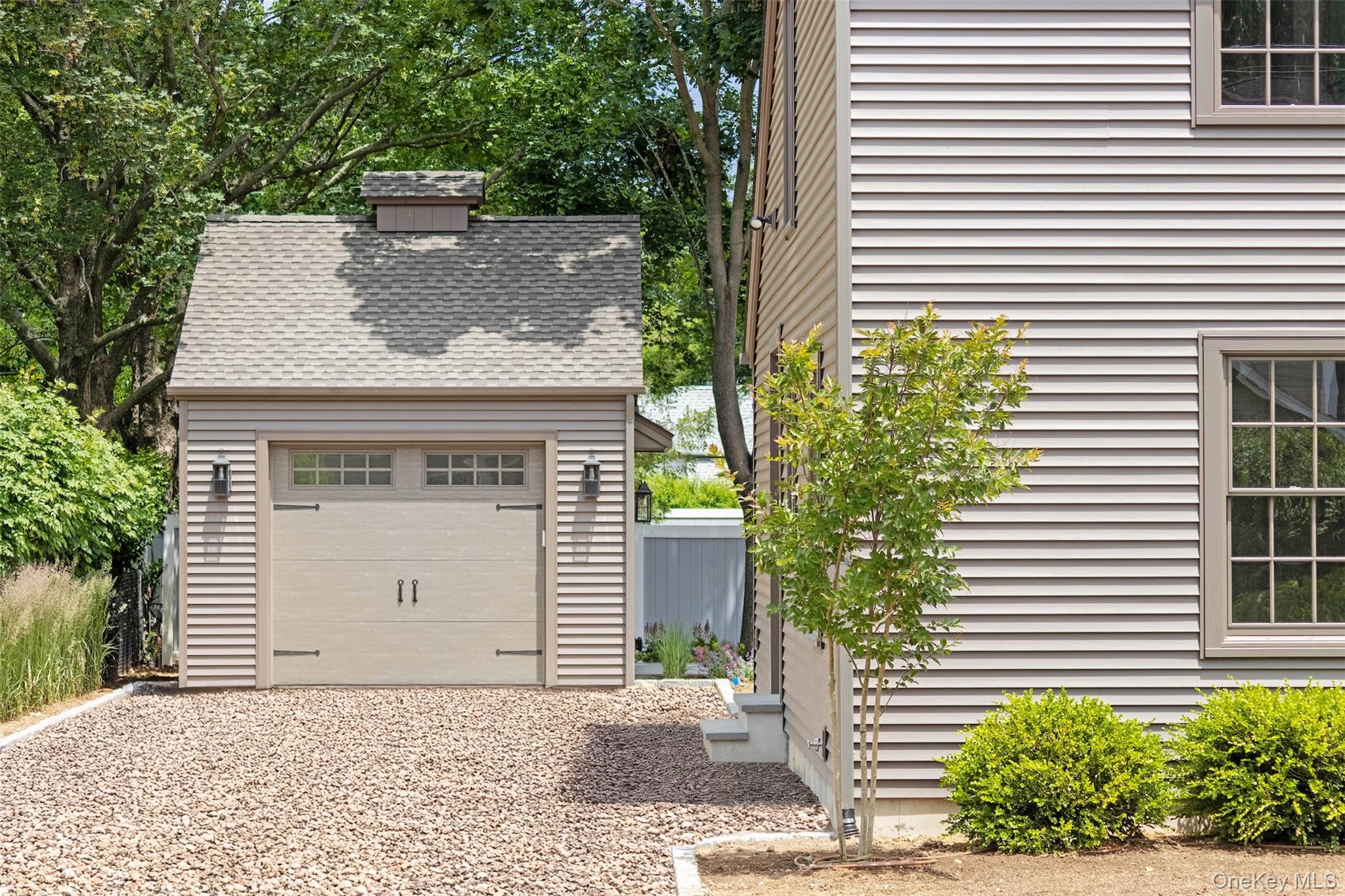130 Sunset Lane Greenport, NY 11944 - Photo 3 of 34 Garage with gravel driveway