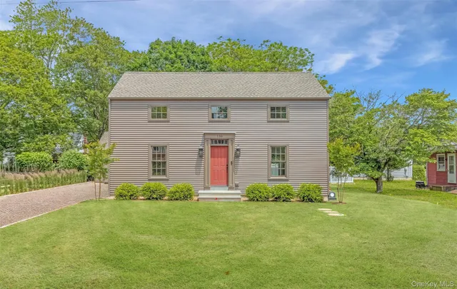 a view of a dry yard with trees