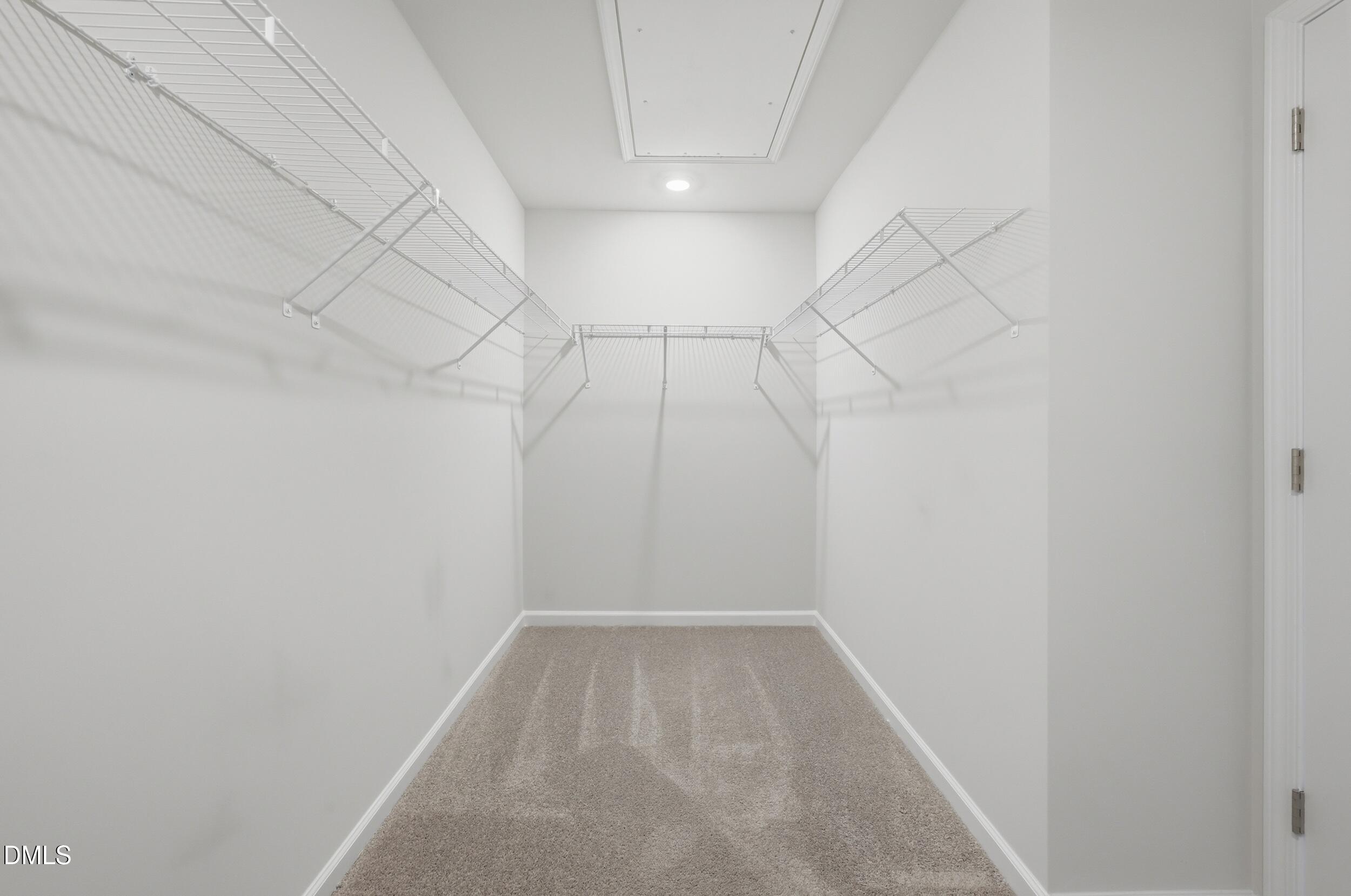 5011 Kota Street Raleigh, NC 27610 - Photo 36 of 42 a view of a room with racks on the wall
