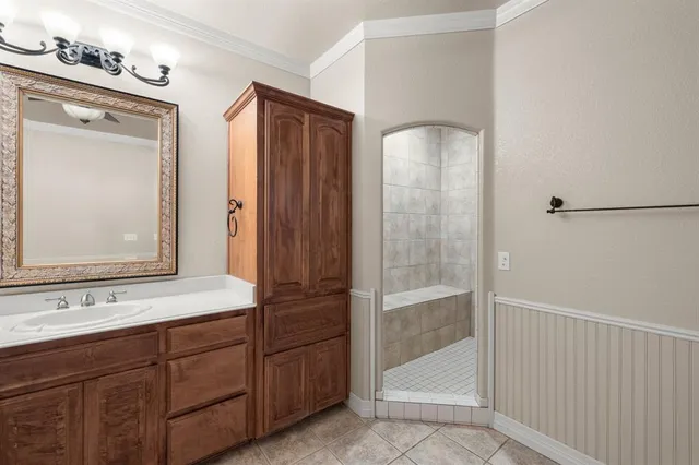 a kitchen with a sink stove and cabinets