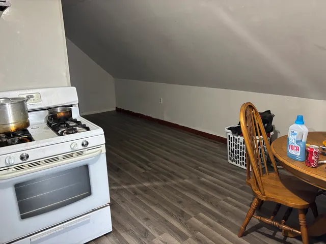 a stove top oven sitting inside of a kitchen