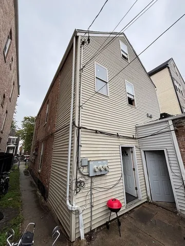 a view of a car park in front of house