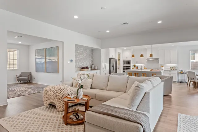 a bed room with bed and ceiling fan