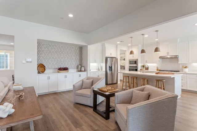 a bathroom with a shower sink and mirror