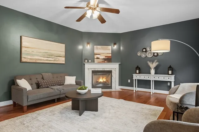 a living room with furniture and a fireplace