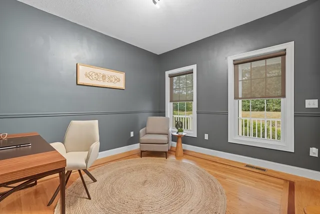 a bedroom with furniture and a window