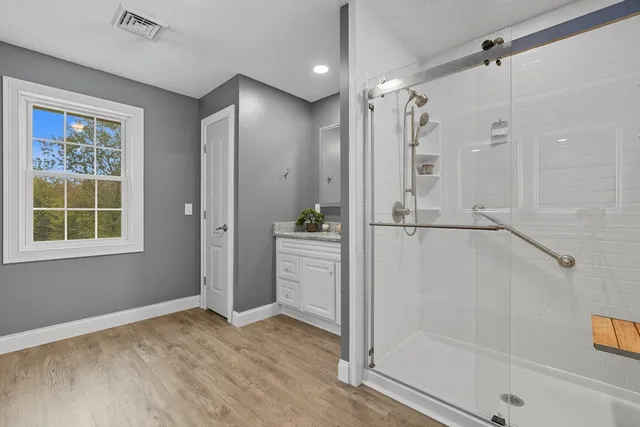 a bathroom with a shower and a tub