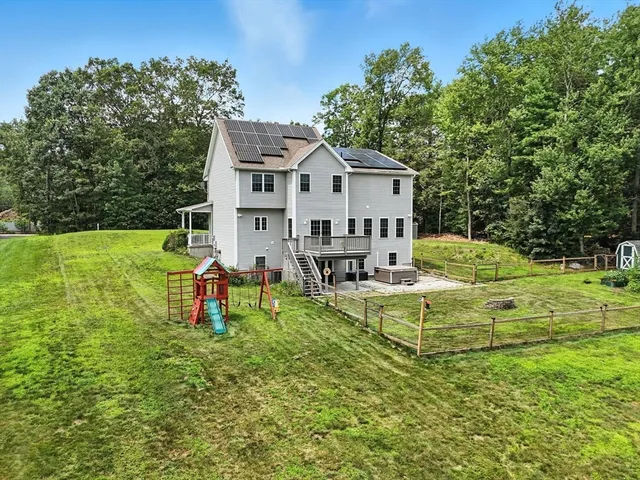 a view of a house with a yard porch and sitting area