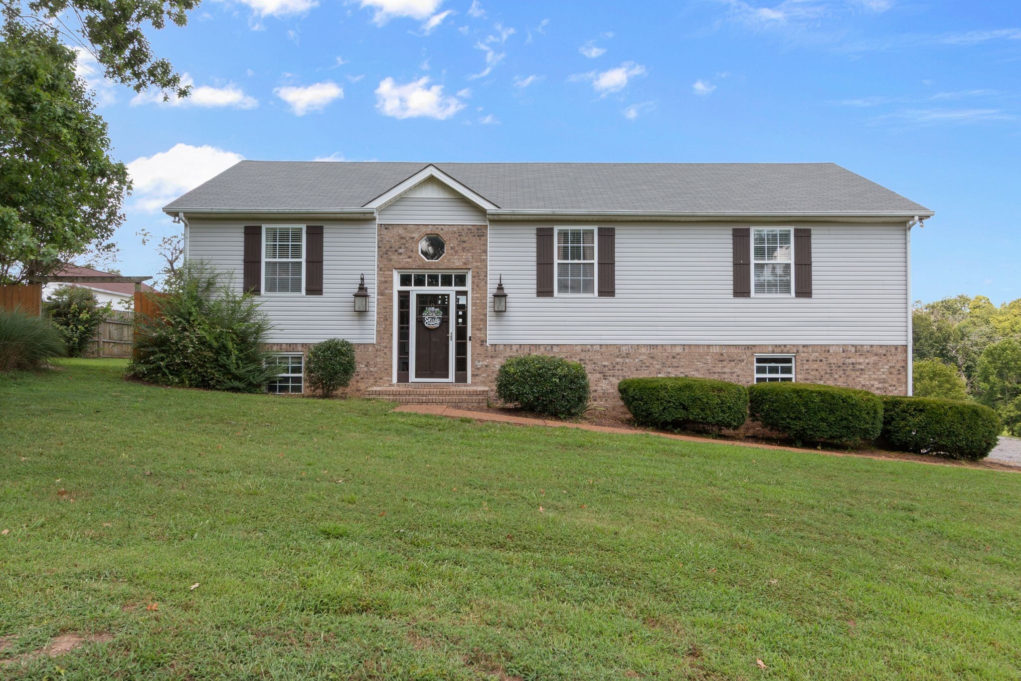 2137 Lee Road Spring Hill, TN 37174 - Photo 1 of 49 a front view of a house with a yard