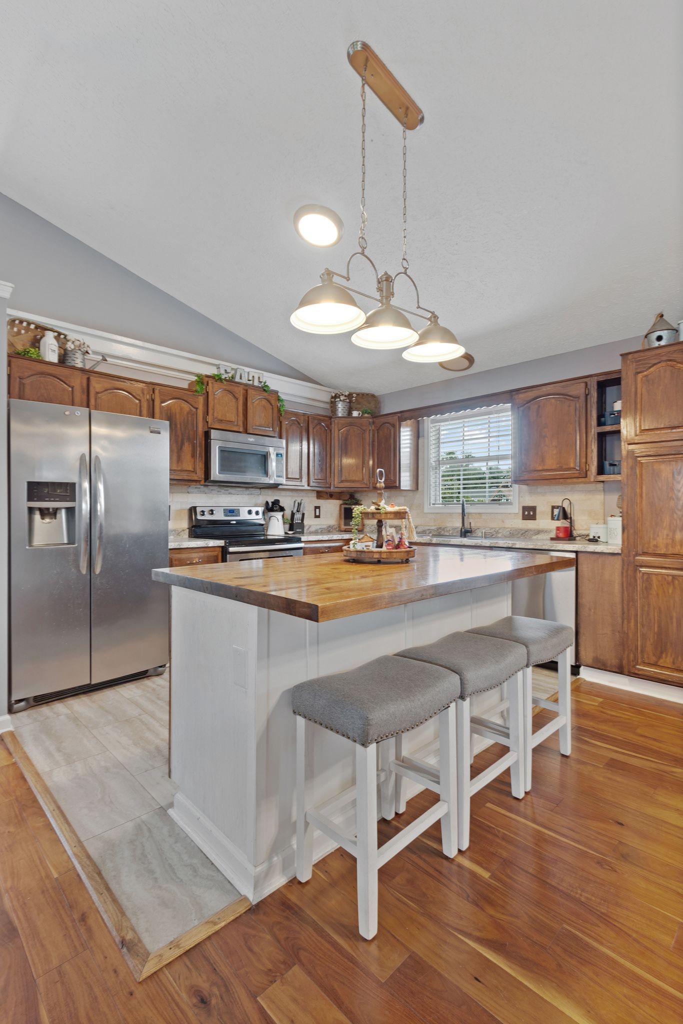 2137 Lee Road Spring Hill, TN 37174 - Photo 15 of 49 a kitchen with kitchen island a counter and chairs