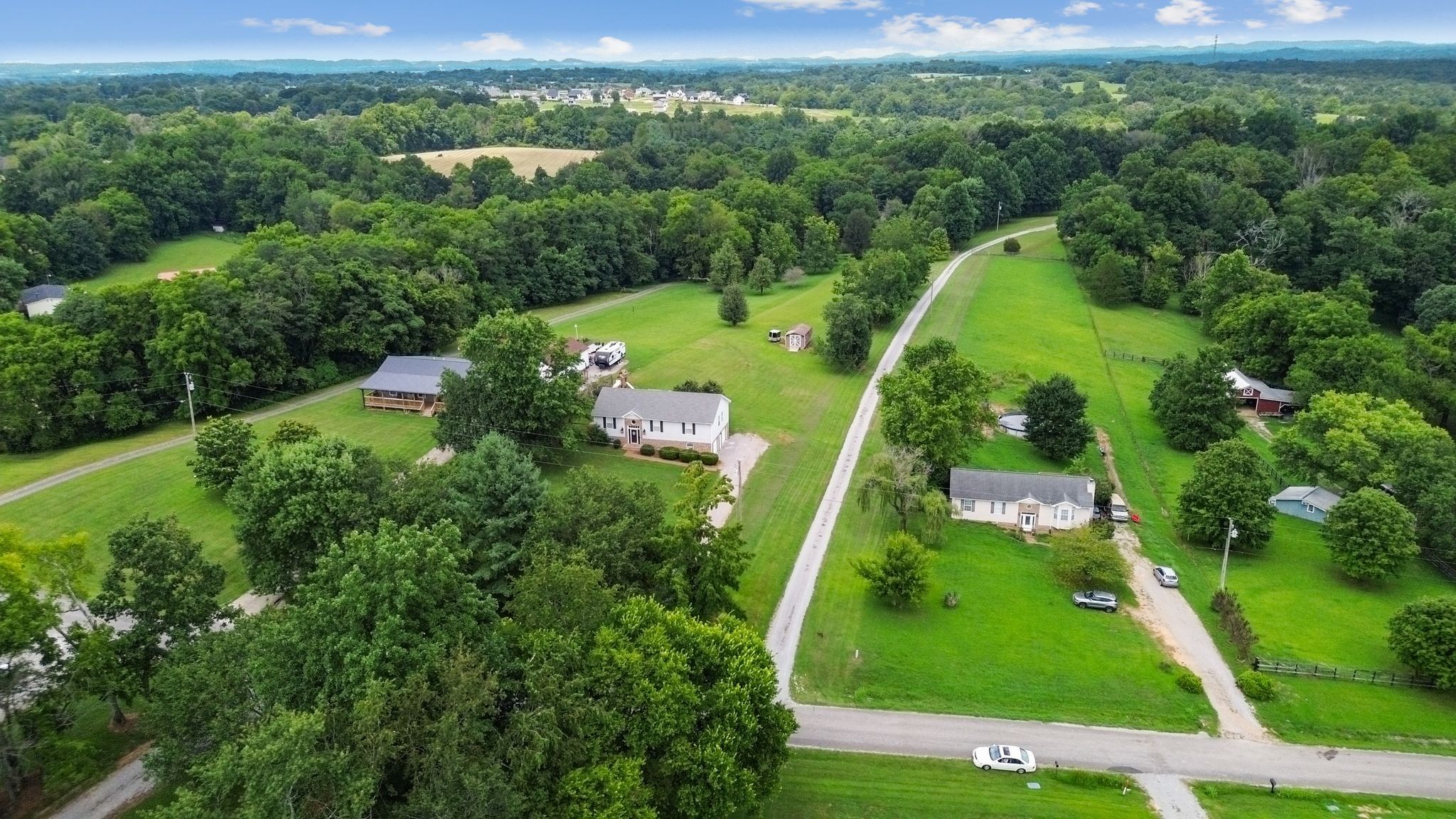 2137 Lee Road Spring Hill, TN 37174 - Photo 2 of 49 an aerial view of a residential houses with outdoor space and trees