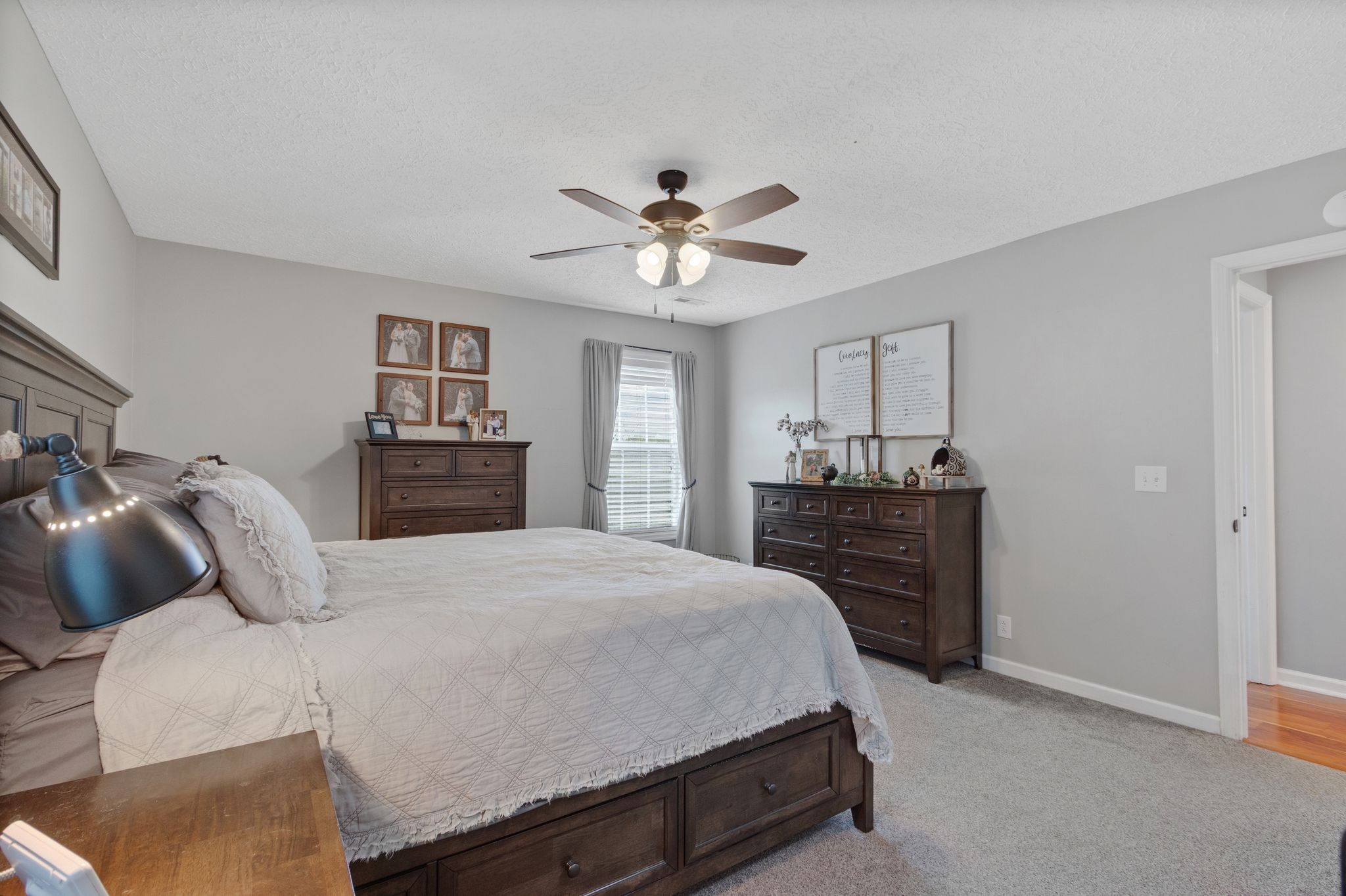 2137 Lee Road Spring Hill, TN 37174 - Photo 22 of 49 a bedroom with a bed and a chandelier